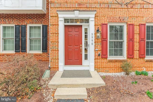 entrance to property with brick siding