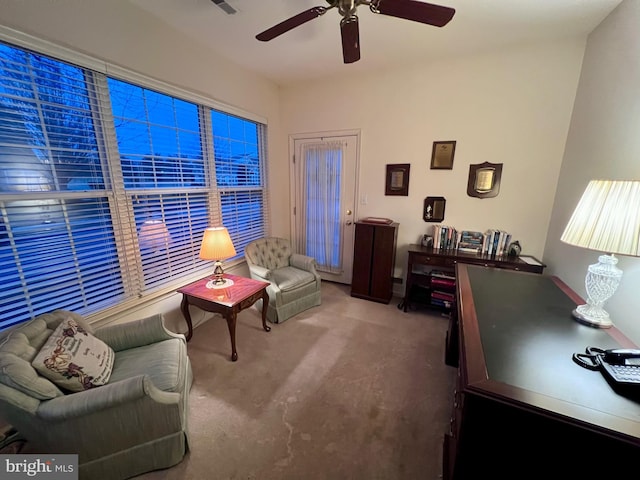 home office with ceiling fan and carpet flooring