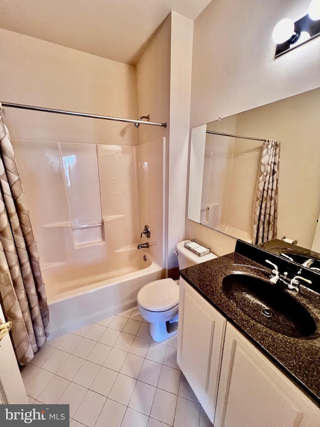 bathroom with toilet, vanity, shower / bath combo with shower curtain, and tile patterned floors