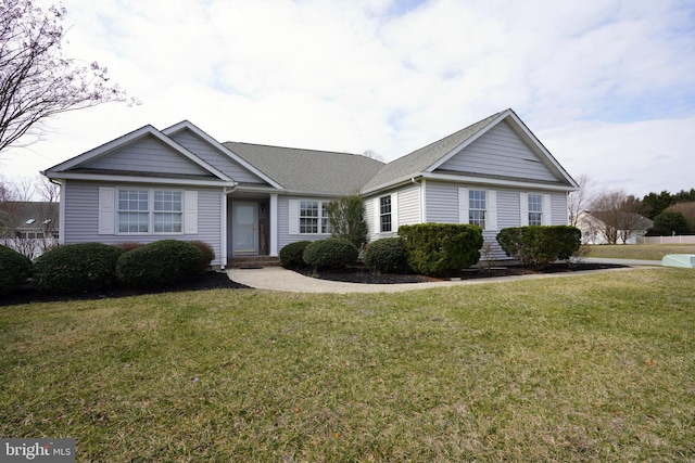 ranch-style house featuring a front yard