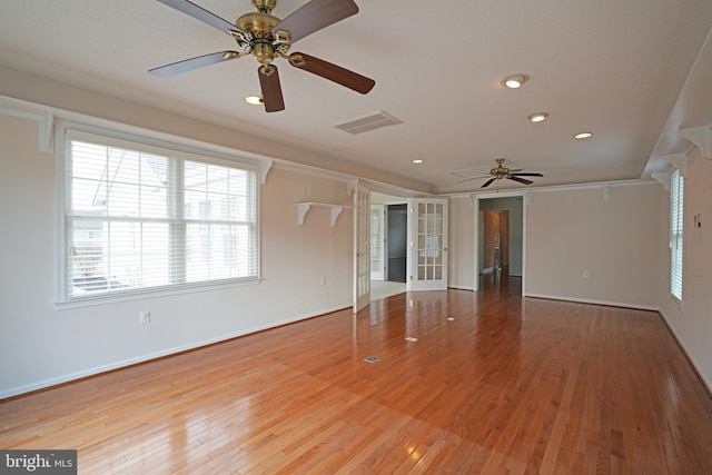 unfurnished room with recessed lighting, visible vents, baseboards, french doors, and hardwood / wood-style floors