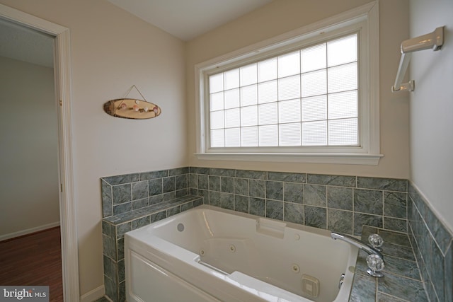 full bath featuring a jetted tub