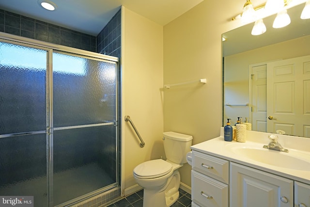 full bathroom with a stall shower, baseboards, toilet, tile patterned floors, and vanity