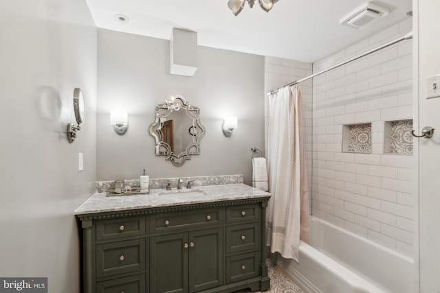 full bath featuring shower / tub combo, vanity, and visible vents