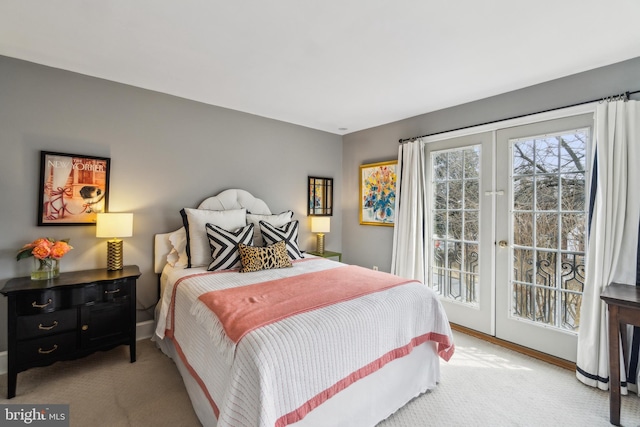 carpeted bedroom featuring access to outside, french doors, and baseboards