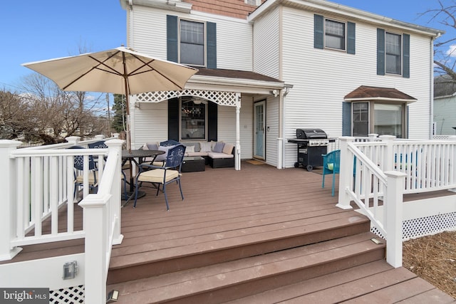 deck with grilling area and outdoor lounge area