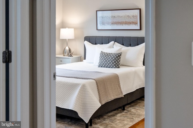 bedroom with wood finished floors