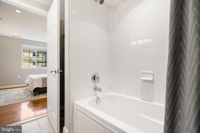 bathroom with tile patterned flooring, shower / bath combination, connected bathroom, and recessed lighting