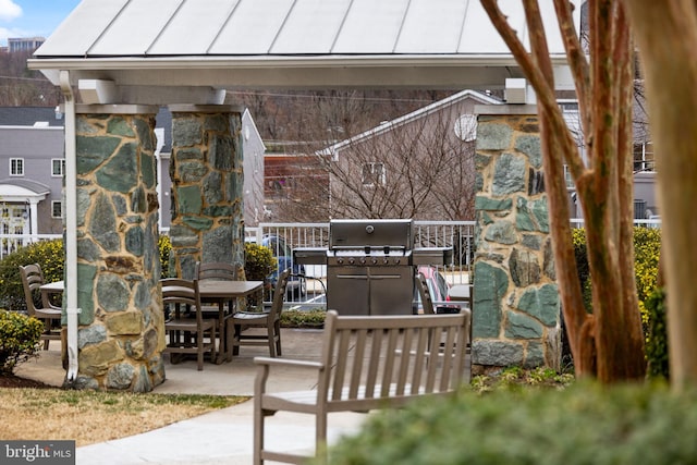 view of patio featuring outdoor dining space and a grill