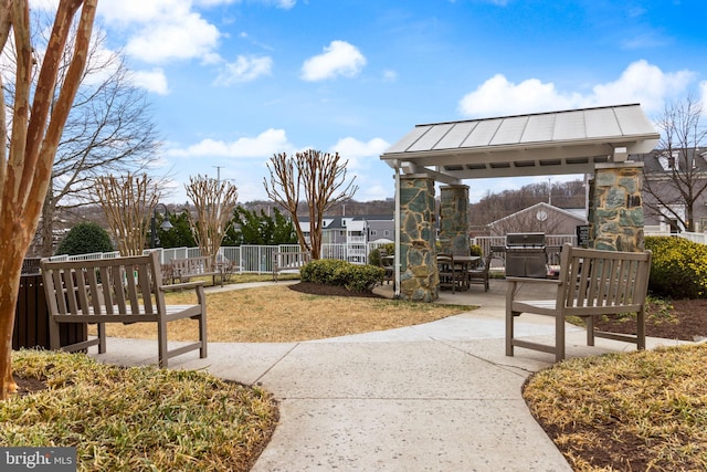 view of property's community with fence