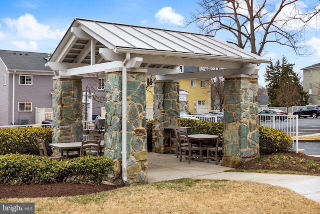 view of patio / terrace featuring fence