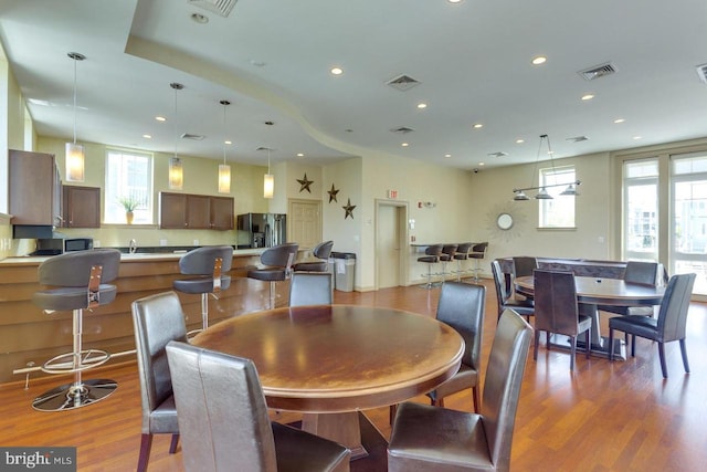 dining room with visible vents, wood finished floors, and recessed lighting