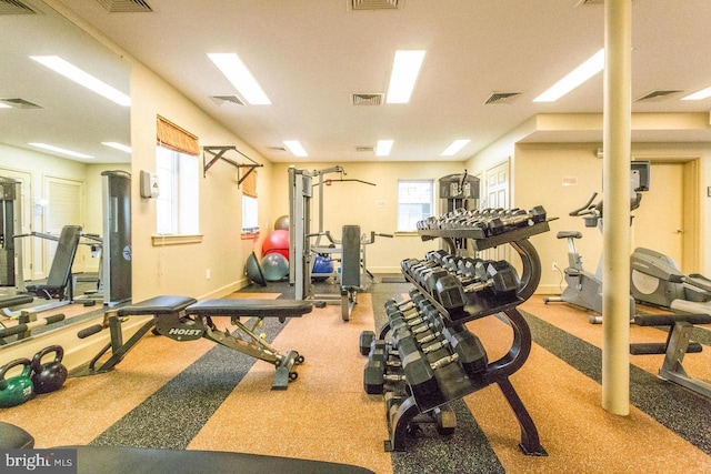 workout area featuring visible vents and baseboards