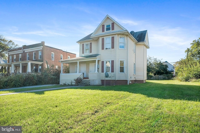 view of front of property featuring a front lawn and a porch