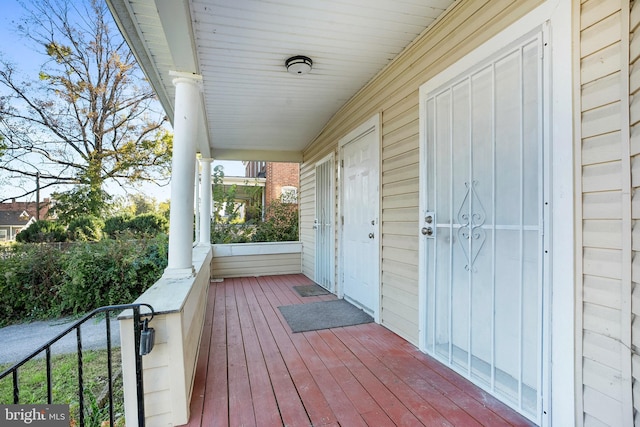 wooden terrace featuring a porch