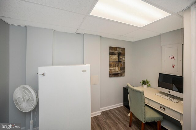 office area featuring wood finished floors, baseboards, and a paneled ceiling