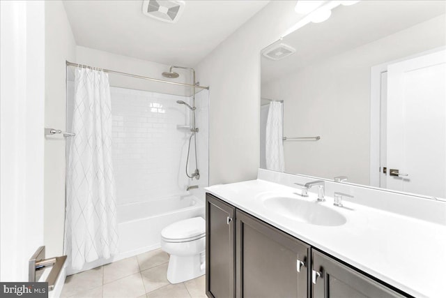 bathroom with visible vents, vanity, toilet, and tile patterned floors