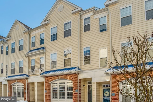 view of property with brick siding