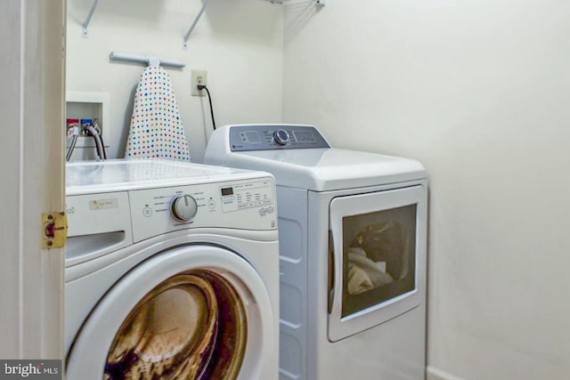 laundry room with washing machine and dryer and laundry area