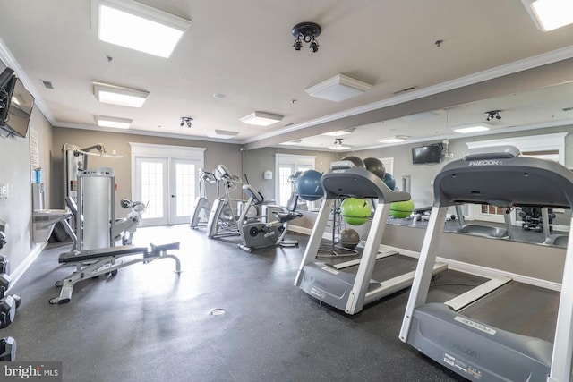 exercise room featuring visible vents, baseboards, crown molding, and french doors