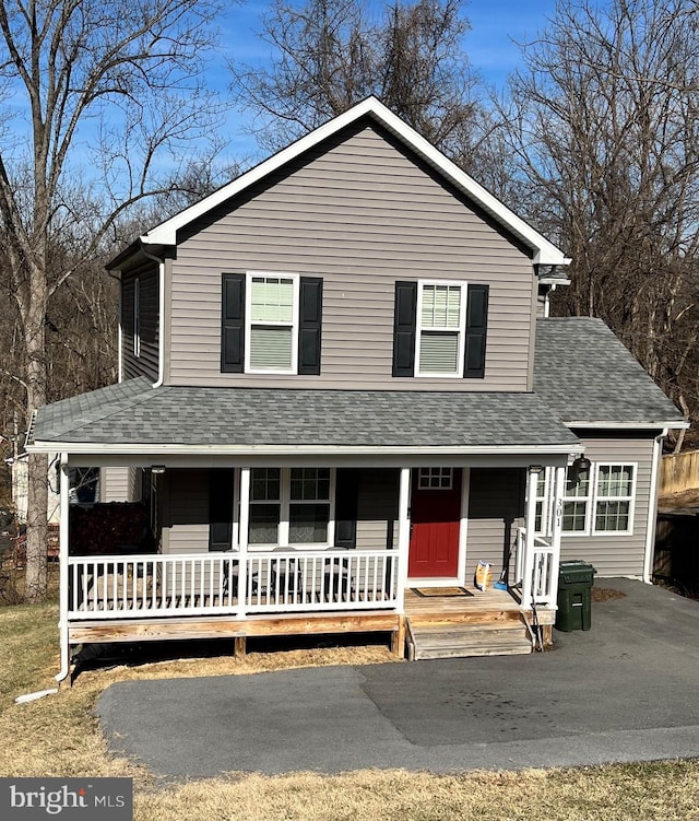 view of front of house featuring a porch and a shingled roof