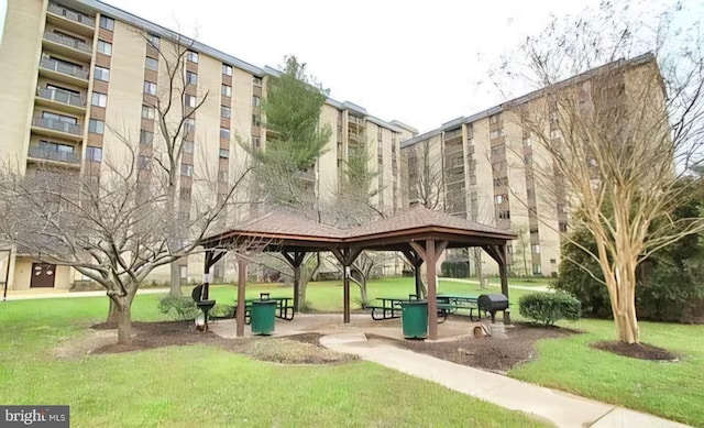 view of home's community with a yard and a gazebo