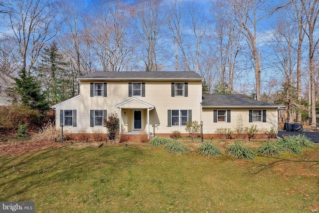 colonial inspired home with a front yard