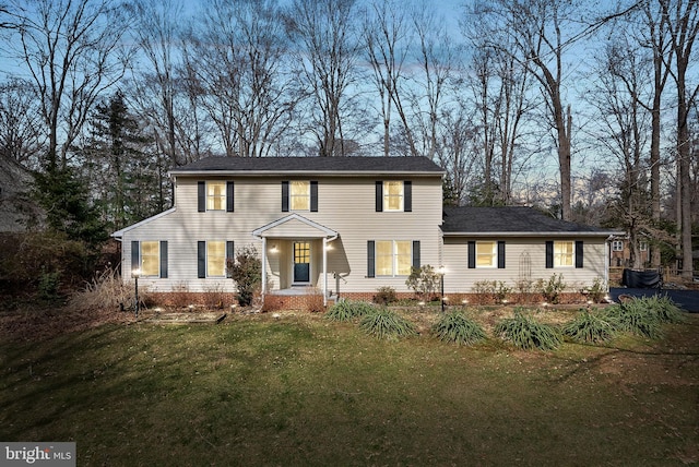 colonial home with a front yard