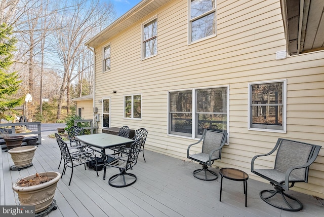 wooden deck with outdoor dining area