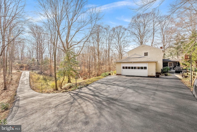 view of property exterior with a garage