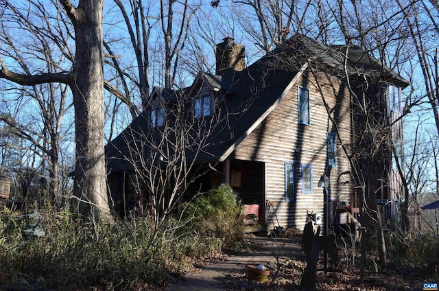 view of home's exterior with a chimney