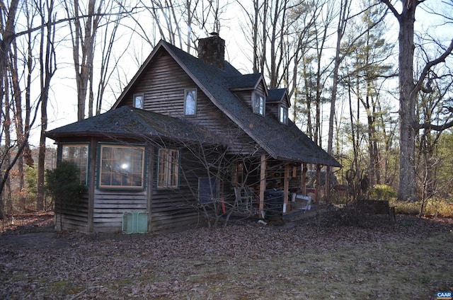 view of home's exterior featuring a chimney