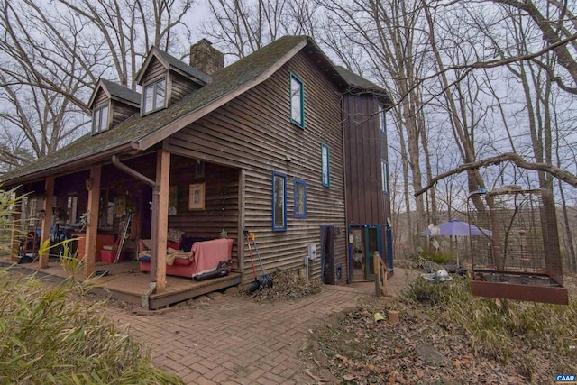 view of side of home with a chimney