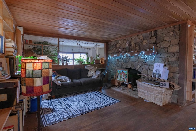 living area with a wood stove, wood finished floors, and wood ceiling