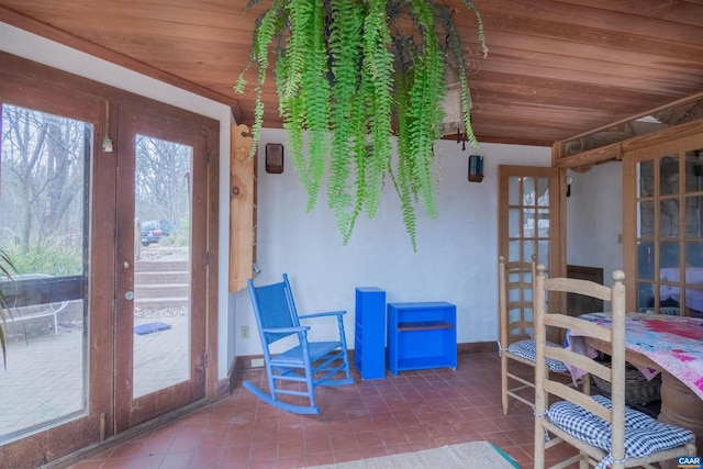 sunroom with wooden ceiling and french doors