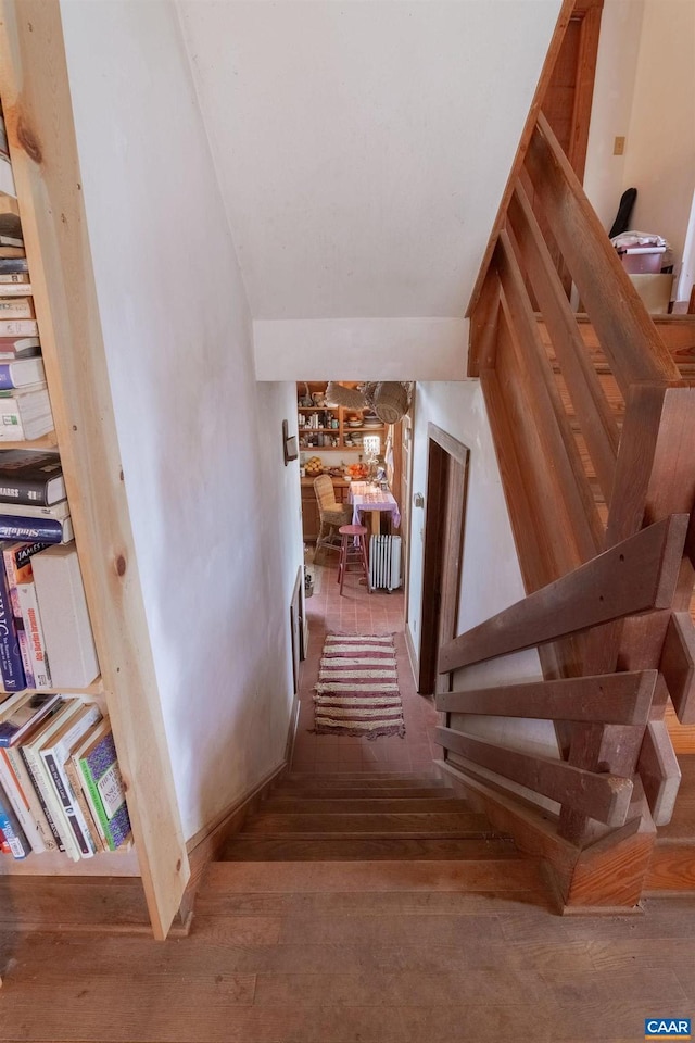 stairway featuring hardwood / wood-style floors