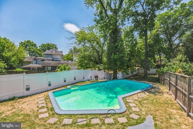 view of swimming pool featuring a fenced backyard and a fenced in pool