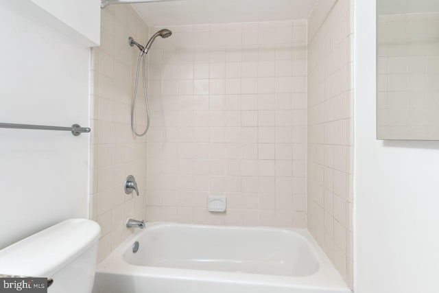 bathroom with toilet and shower / tub combination