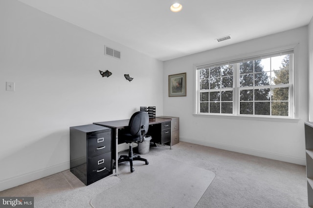 office featuring carpet, visible vents, and baseboards