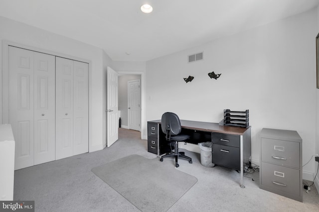 carpeted office space featuring visible vents