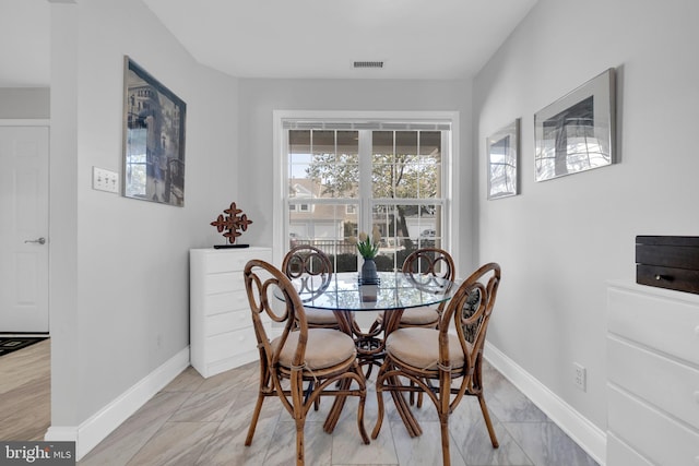 dining area with visible vents and baseboards