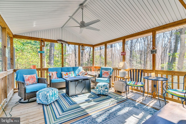 sunroom / solarium featuring lofted ceiling and ceiling fan