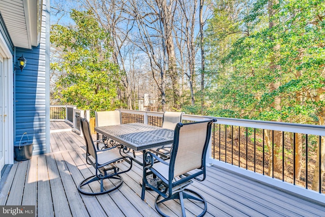 wooden deck featuring outdoor dining space