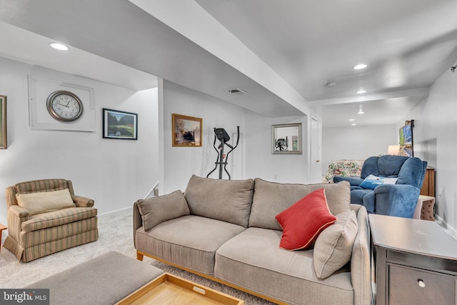 carpeted living room featuring baseboards, visible vents, and recessed lighting