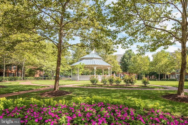 view of community with a lawn and a gazebo