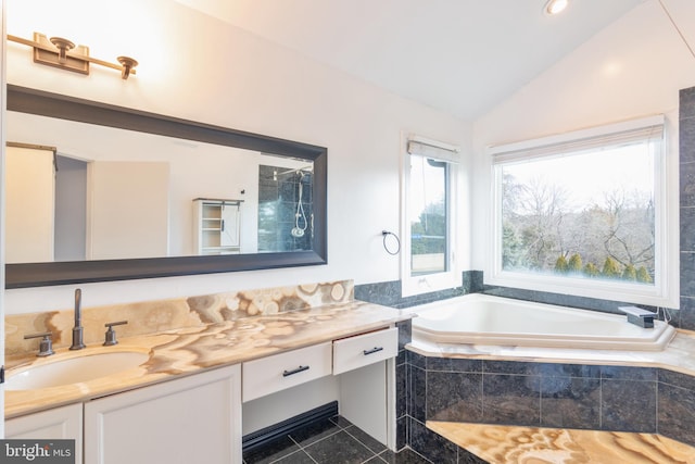 full bath with lofted ceiling, tile patterned floors, a bath, and vanity