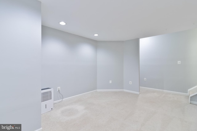 carpeted empty room featuring recessed lighting and baseboards