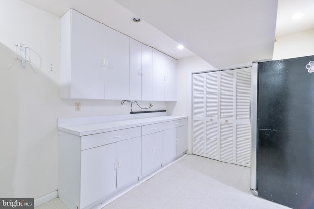 bathroom featuring recessed lighting and tile patterned floors