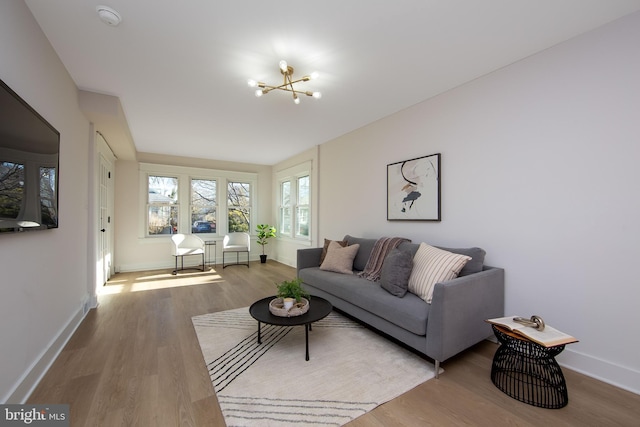 living area featuring wood finished floors and baseboards