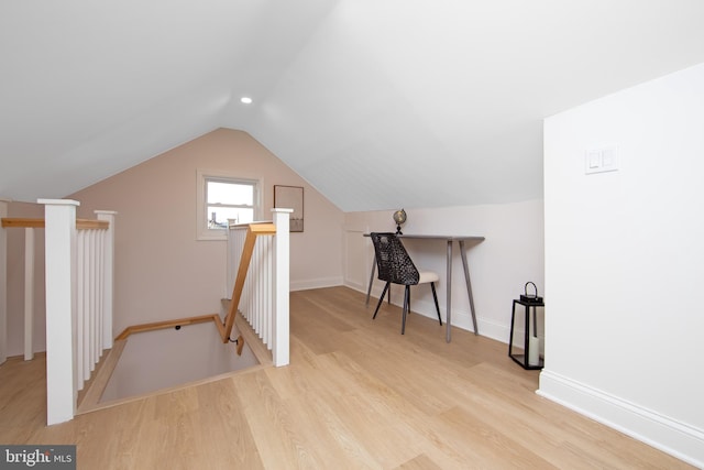 additional living space featuring baseboards, vaulted ceiling, wood finished floors, and recessed lighting